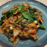 Drunken Noodle · Broad rice noodle, chilli, basil, Chinese broccoli, tomato, egg, peppercorn, kaffir leave, a...
