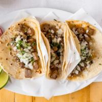 Steak Taco · Soft corn tortilla folded and stuffed with grilled steak.