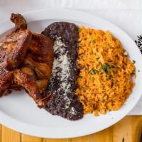 1/2 Rostisserie Chicken Platter · Served with rice and beans on the side.
