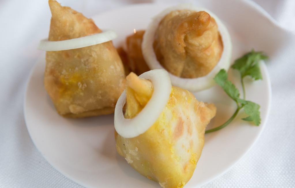 Vegetable Samosa / Chicken Samosa · Crispy pastry turnover filled with spiced minced meat or veg.