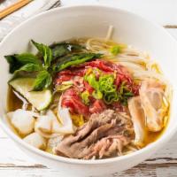 Everything In One Pho Soup · Served with beef broth soup, rare eye round, cooked beef, beef tripe, beef tendon, onions, a...