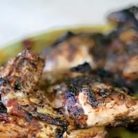 Jerk Chicken  · original jamaican jerk chicken have it your way spicy or sweet sauce and your choice of fest...