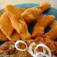 Escovitch Snapper · Snapper fish with fried dumplings festival and pepper salad