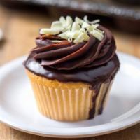 Boston Cream · classic vanilla cake with a pastry cream filling, topped with chocolate ganache and white ch...