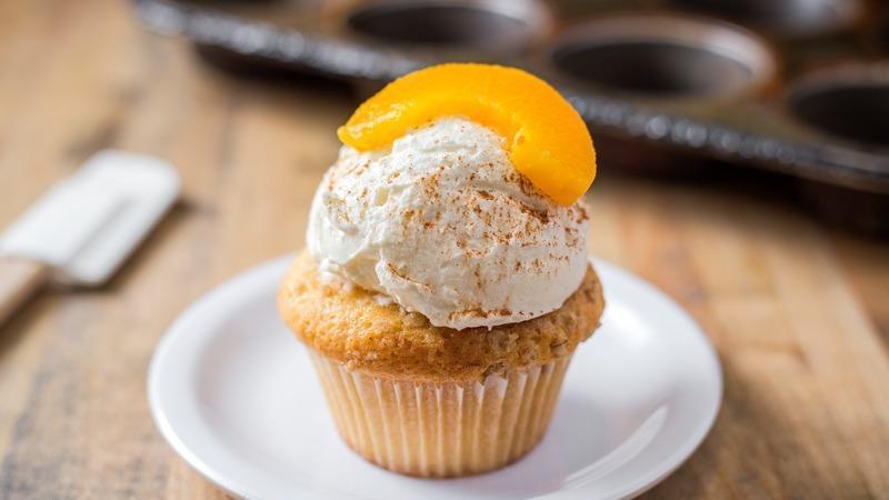 Peach Cobbler · vanilla cake filled with cinnamon peach puree, topped with brown sugar streusel, homemade whipped cream and a sliced peach

*must be kept cold