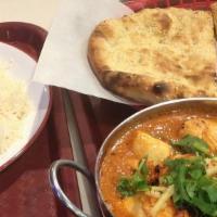 Chicken Tikka Masala With Naan · Boneless cubed chicken marinated in yogurt and spices, cooked in clay oven.
