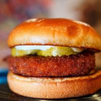 Hot Chicken Sandwich · Spicy Breaded Chicken Breast severed with Pickles and Mayo on a toasted potato roll.