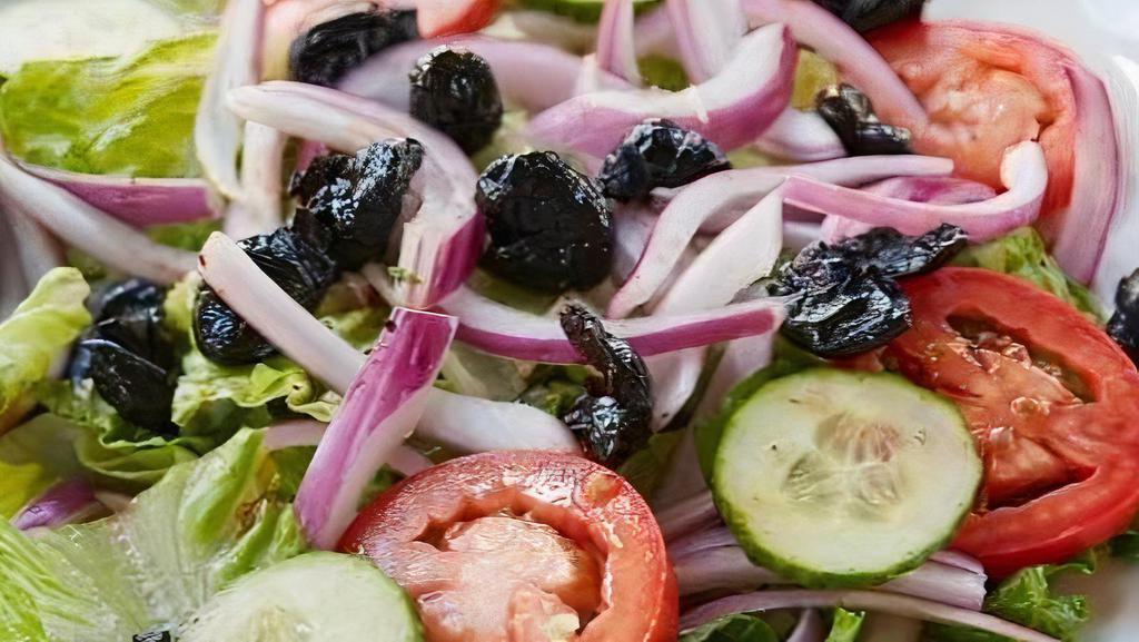 House Salad · Romaine, cured black olives, cucumbers, Roma tomatoes and red onions. Served with house dressing.