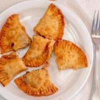 Empanadas · Puff pastry with cheese and choice of chicken or beef.