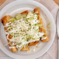 Flautas · Crispy golden corn tortilla rolled with chicken. Top with lettuces farm cheese and sour cream