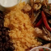 Chicken Fajita · Grilled  chicken  with pepper and onions with side of black beans and  yellow rice