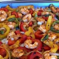 Shrimp  Fajita · Sauteed peppers  and onions  with grilled  shrimp  side of yellow  rice and black beans