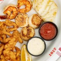 Seafood Sampler · Cod, day boat scallops, shrimp and tender fried clam strips, *broiled or fried*