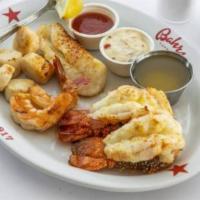 Fisherman'S Platter · Two broiled Brazilian three ounces lobster tails with day boat scallops, jumbo shrimp and cod.