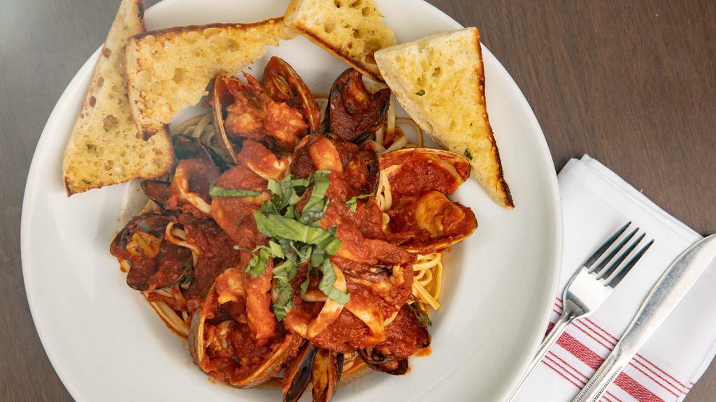 Seafood Marinara · Sautéed shrimp, clams, mussels, scallops, calamari in a marinara sauce. Served over linguine.