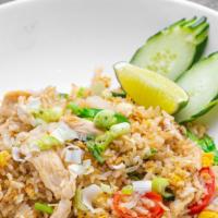 Thai Fried Rice · Steamed jasmine rice with egg garlic, onion, scallion, tomatoes and Chinese broccoli with yo...