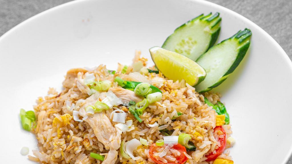 Thai Fried Rice · Steamed jasmine rice with egg garlic, onion, scallion, tomatoes and Chinese broccoli with your choice of protein.