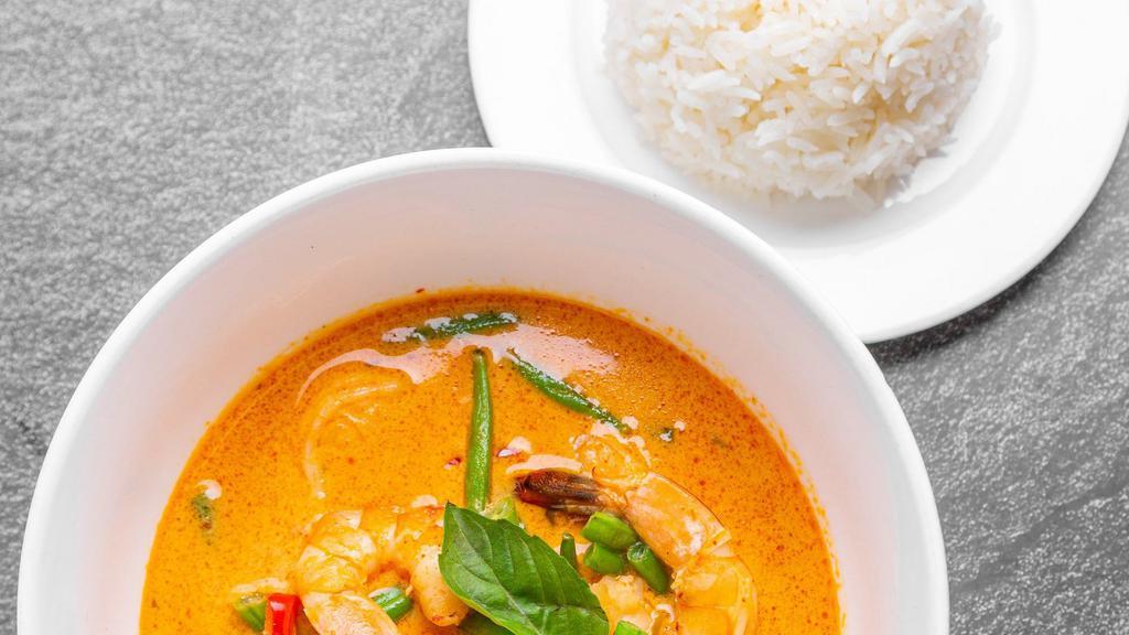 Panang Curry · Panang curry with kaffir lime leaves, chili, coconut milk, basil, string beans and peanut with your choice of spice.