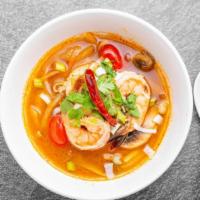Tom Yum Soup · Spicy. Shrimp chili paste with fresh Thai chili, lemongrass, lime, onion mushroom and kaffir...