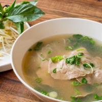 Phở Tái · Traditional pho with beef eye round. Beef broth and rice noodles. Topped with scallion, onio...