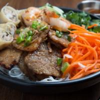 Bún Shop · #1 favorite. Grilled pork chop, grilled shrimp and spring roll. Rice vermicelli topped with ...