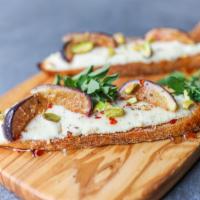 Almond Ricotta Bruschetta · Toasted baguette, baked ricotta, caramelized mission figs, pistachios, chili, agave, fresh o...