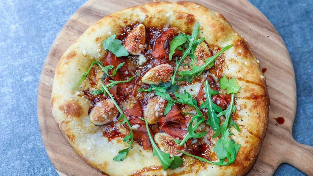 Fig Jam And Prosciutto · Housemade fig jam, fresh mission figs, prosciutto, baby arugula, evoo, parmesan, aged balsamic.