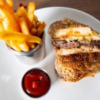 Grilled Steak Sandwich · Marinated skirt steak, caramelized onions, roasted red peppers, sharp cheddar cheese, and OE...