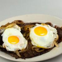 Bistec A Caballo · Steak with fried egg.