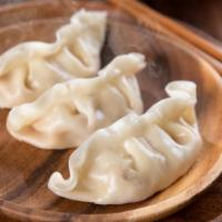 Dim Sum · Five pieces of delicious steamed dumplings.