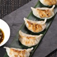 Assorted Dumplings · Six pieces of delicious steamed dumplings with various stuffings.