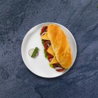 Roast Beef Sandwich  · Roast beef, pepper jack cheese, hot pepper, lettuce, tomato, onions, and mustard served on y...