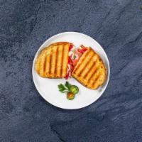 Capri Panini · Smoked turkey, beef salami, provolone cheese, spinach, roasted peppers, and balsamic vinaigr...