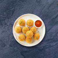 Mac & Cheese Balls · (Vegetarian) Bite-size clumps of mac and cheese breaded and fried until golden brown.