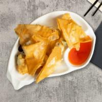 Crab Rangoon · Fried imitation crab meat, celery and cream cheese served with sweet chili sauce.