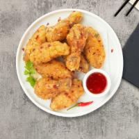 Thai Chicken Wings · Thai-style chicken wings. Served with sweet chili sauce.