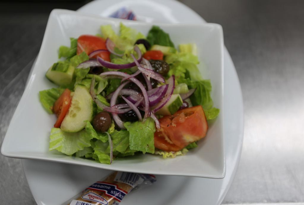 House Garden Salad · Mixed field greens, diced tomatoes, peppers, onions, cucumbers, egg, croutons and garnish.