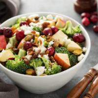 Harvest Salad · Spring mix salad tossed with sliced apples, dried cranberries, roasted peppers, candied waln...