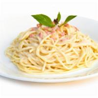 Spaghetti Carbonara · Warm spaghetti pasta topped with a creamy, cheesy, garlic sauce.