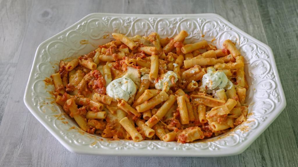 Baked Ziti With Ricotta Cheese · Classic baked ziti pasta prepared with house made tomato sauce and fresh ricotta cheese.