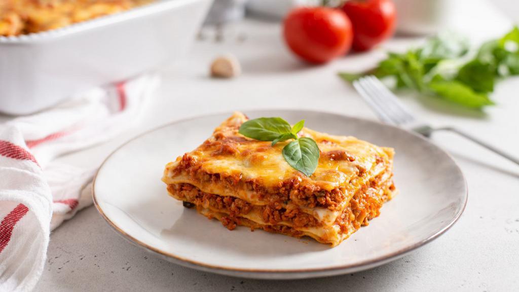 Lasagna · Fresh house made lasagna prepared with layers of pasta filled with minced beef, cheeses, and savory marinara sauce.