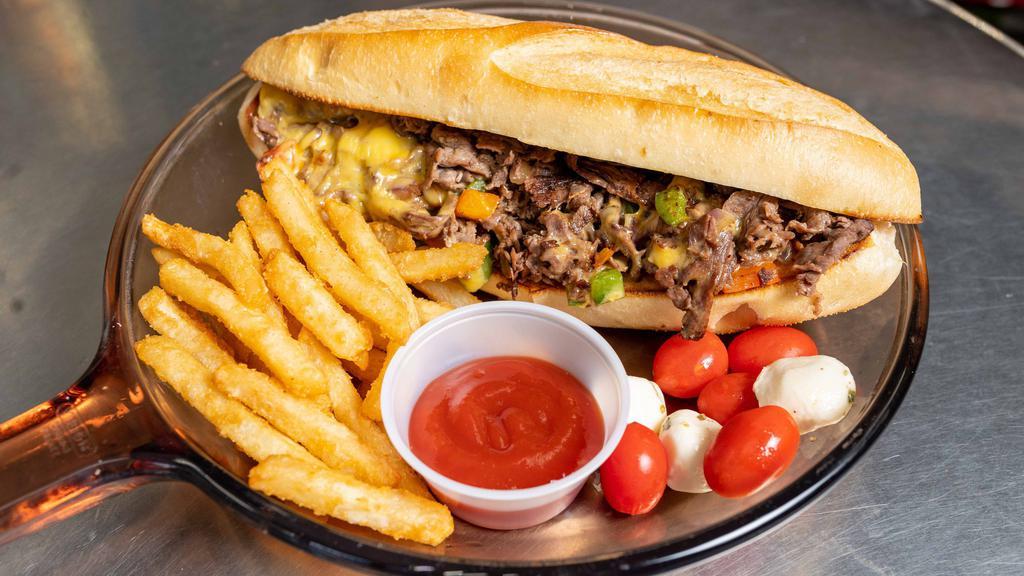Philly Cheesesteak Sandwich · Thinly sliced steak, grilled peppers, grilled onions, melted american cheese and mushrooms.