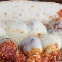Homemade Meatball Parm Sandwich · Soft and tender meatballs with marinara sauce and melted mozzarella cheese topped with grate...