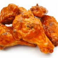 Buffalo Wings · Crispy on the outside, juicy on the inside chicken wings smothered with our secret sauce.