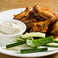 Persian Spiced Chicken Wings · Fried wings with a sweet chili sauce.