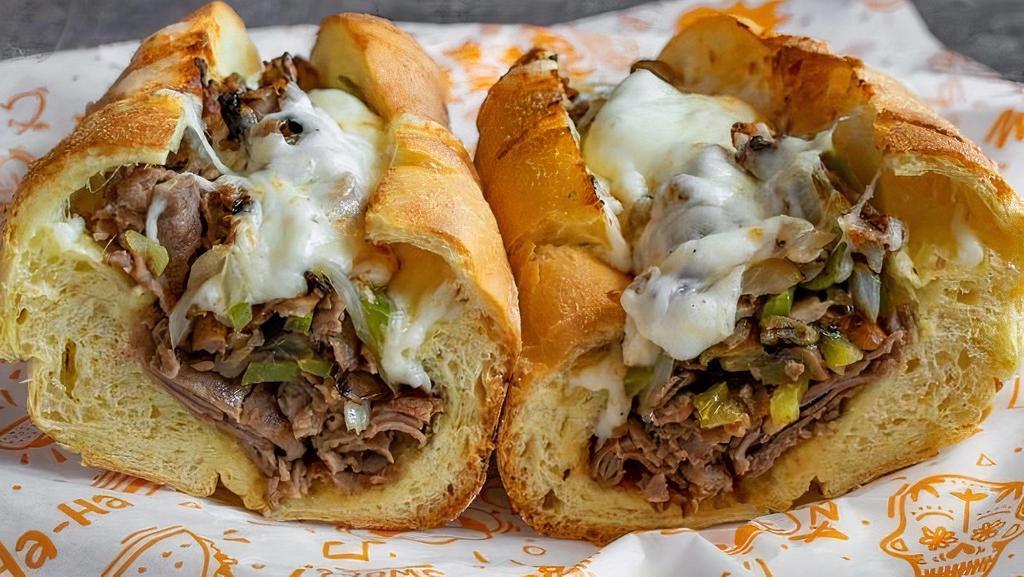 Philly Cheesesteak · Sliced ribeye steak, melted cheese, grilled onions, peppers, sauteed mushrooms, hoagie roll.