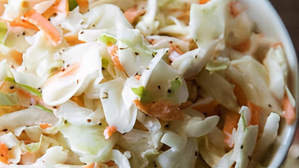 Cole Slaw · Creamy, tangy-sweet coleslaw salad that packs a punch besides a good ol' sandwich.