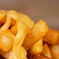 Cheese Fries · The only thing better than French fries is cheese fries. Steak cut fries topped with cheddar...