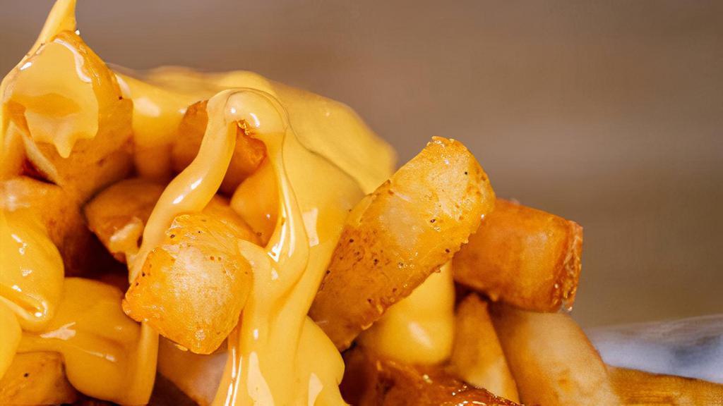 Cheese Fries · The only thing better than French fries is cheese fries. Steak cut fries topped with cheddar cheese sauce.