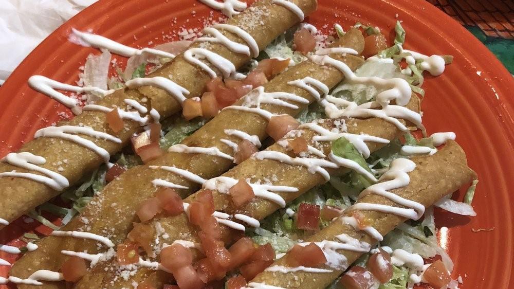 Flautas · Four corn tortillas filled with shredded chicken rolled, and deep fried. Served on a bed of lettuce. Topped with sour cream, and cotija cheese. Served with rice and refried beans.